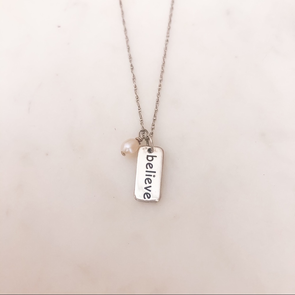 Silver and pearl charm necklace